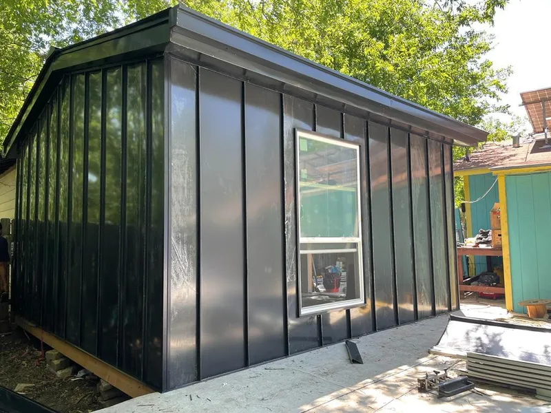 Black standing seam metal wall panels for Metal Roof Installation in Lansing